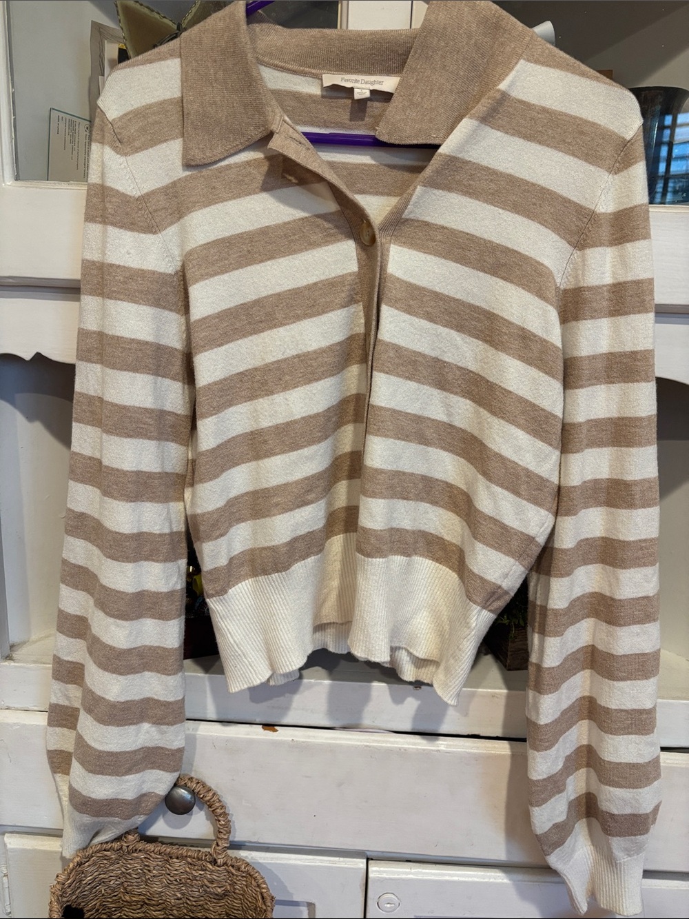 The Favorite Daughter Belle Striped Polo Top features a beige and cream stripe